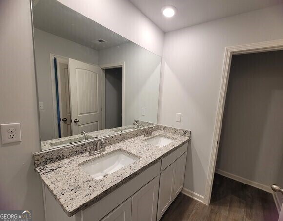 502 Holsteiner Road, Unit 62 Hogansville, GA 30230 - Photo 9 of 14 a bathroom with a granite countertop sink and a mirror