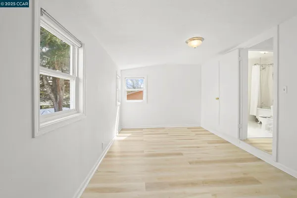 a view of an empty room and window