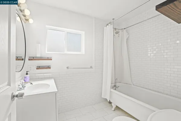 a bathroom with a sink a bath tub and a shower