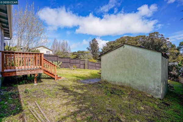 a view of a backyard with sitting area