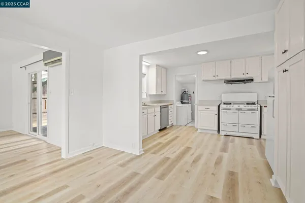 a view of kitchen with wooden floor