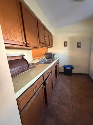 a kitchen with a sink and cabinets
