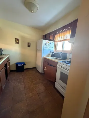a kitchen with a sink and a stove top oven