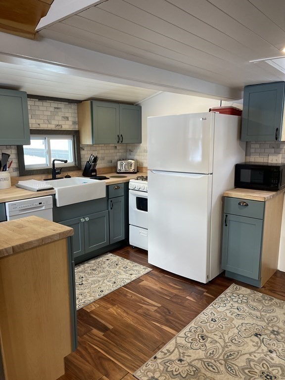 134 Kibbe Road Otis, MA 01029 - Photo 12 of 42 a kitchen with a refrigerator sink and cabinets