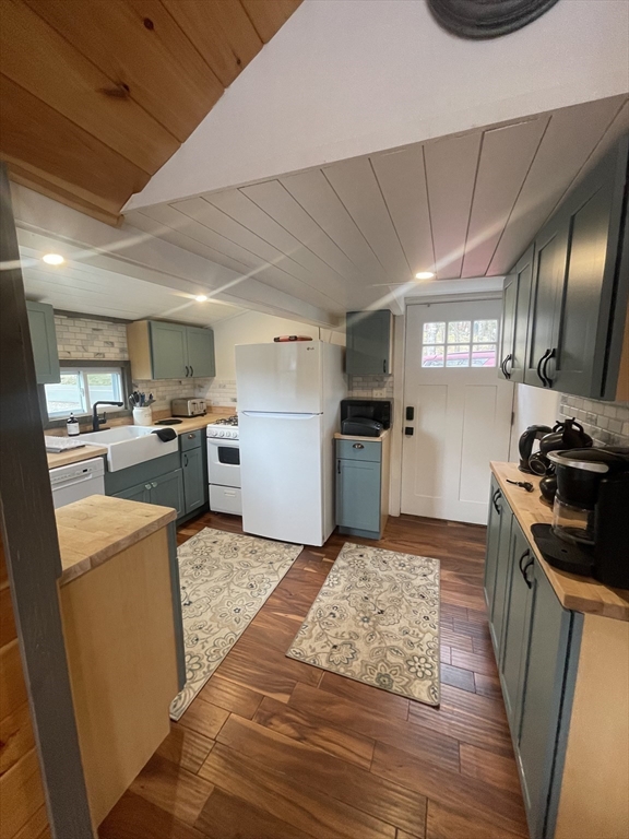 134 Kibbe Road Otis, MA 01029 - Photo 13 of 42 a kitchen with microwave a stove and refrigerator