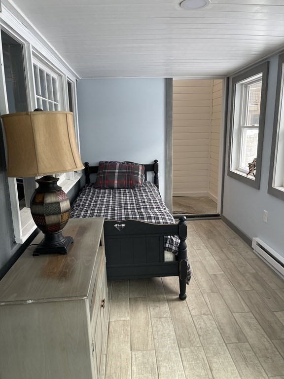 134 Kibbe Road Otis, MA 01029 - Photo 22 of 42 a bed sitting in a room next to a window