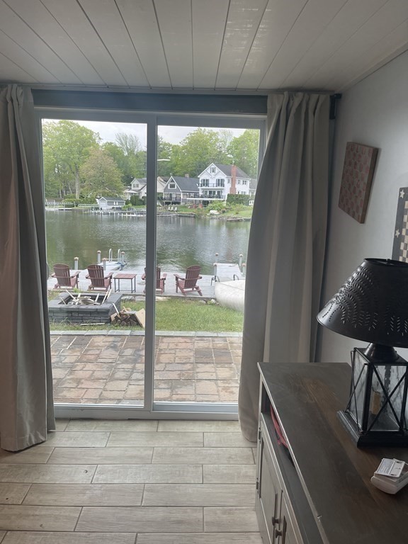 134 Kibbe Road Otis, MA 01029 - Photo 26 of 42 a view of a living room and floor to ceiling window