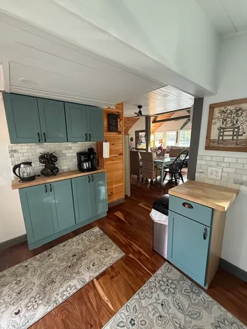 a view of a livingroom with furniture and wooden floor
