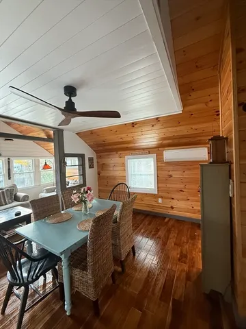 a room with kitchen island granite countertop furniture and a fireplace