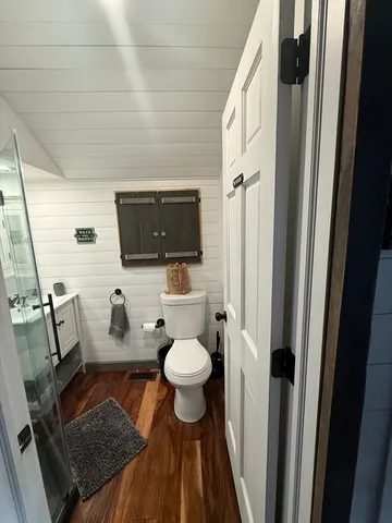 a view of a dining room with furniture wooden floor and chandelier