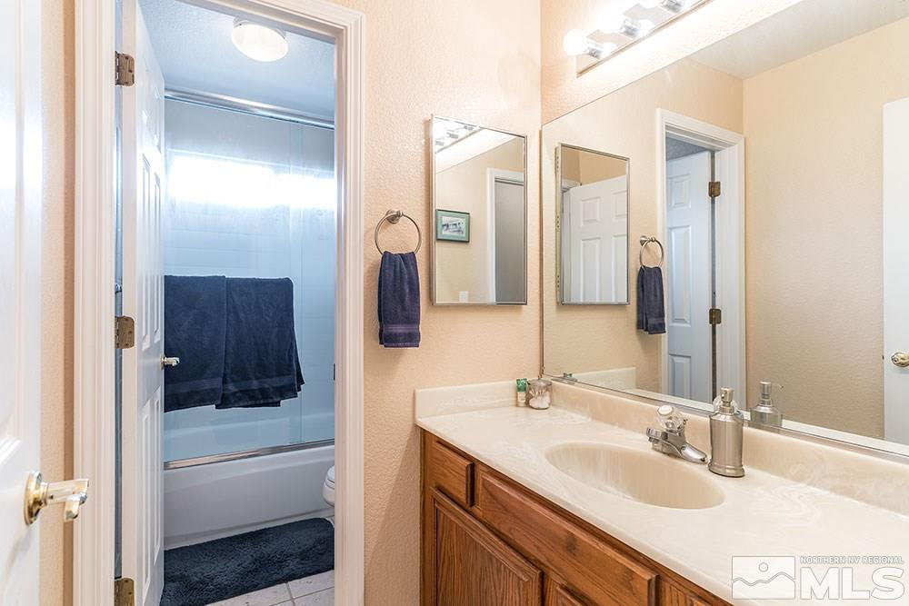 40 Ghost Rider Court Reno, NV 89511 - Photo 16 of 27 a bathroom with a sink and a mirror