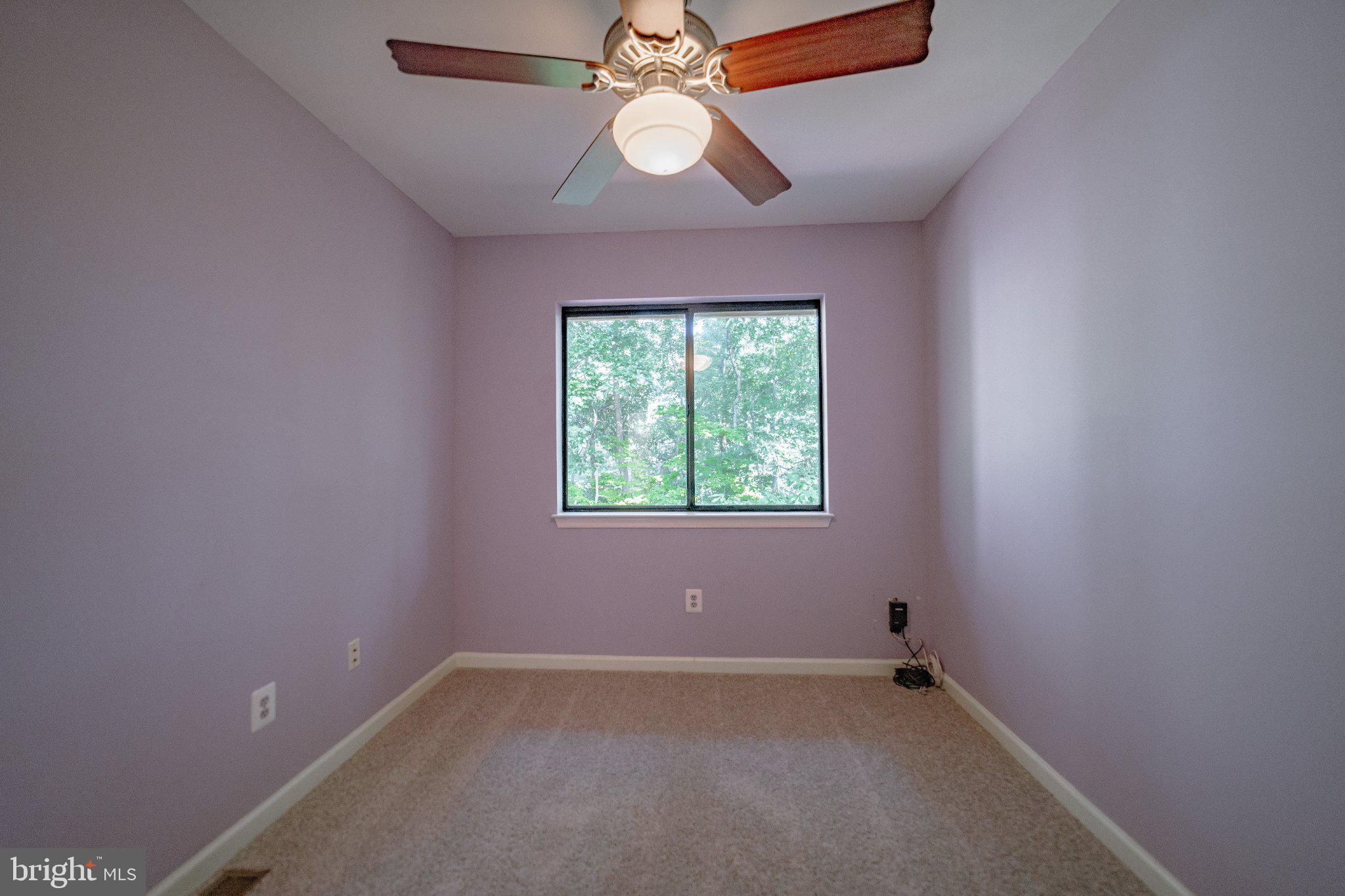 2205 Southgate Square, Unit 2205 Reston, VA 20191 - Photo 20 of 26 Serene purple room with natural light.