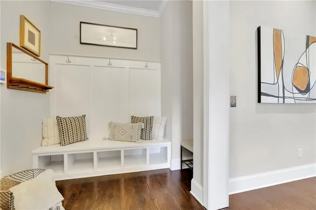 a kitchen with stainless steel appliances kitchen island granite countertop a stove a sink a dining table and chairs