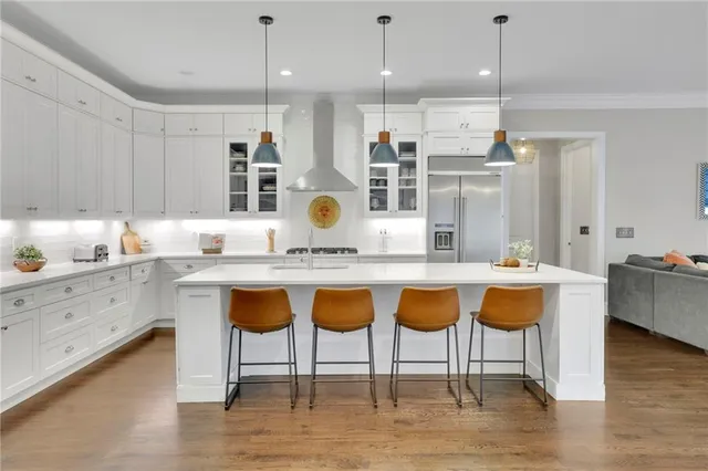a kitchen that has a lot of cabinets in it
