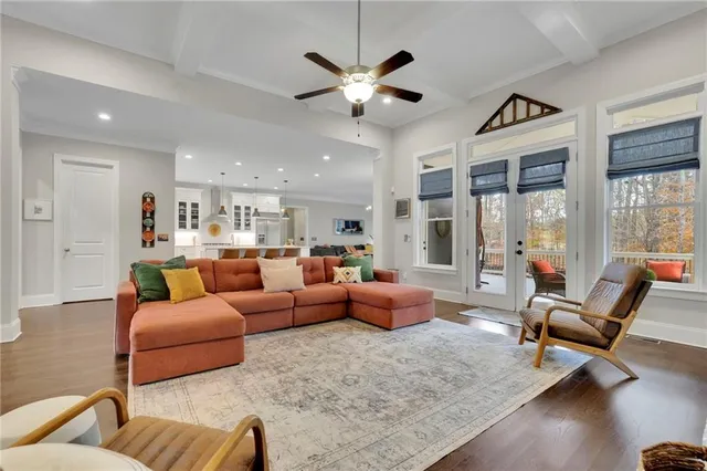 a bedroom with furniture and a large window