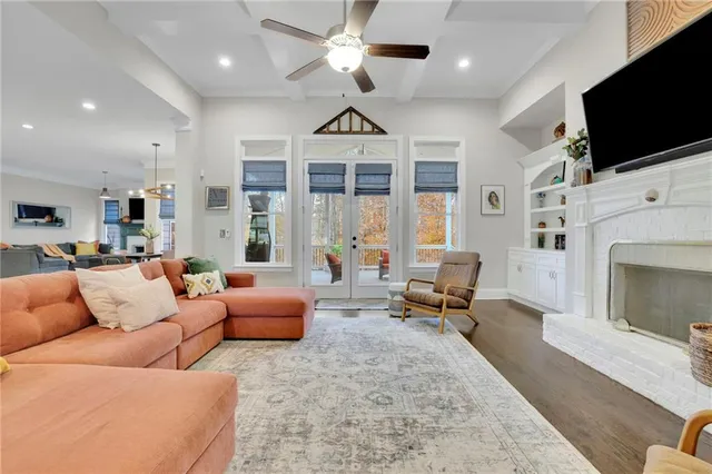 a white bath tub sitting next to a shower