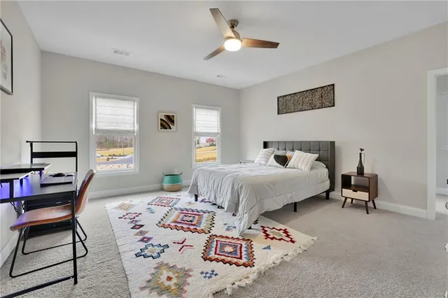 a kitchen with kitchen island granite countertop a refrigerator and a stove