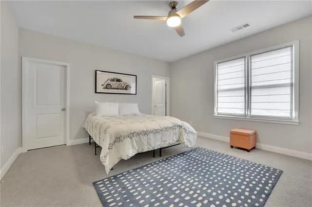 a bed room with a bed and a window