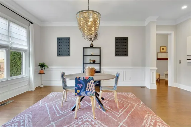 a living room with furniture rug and a window
