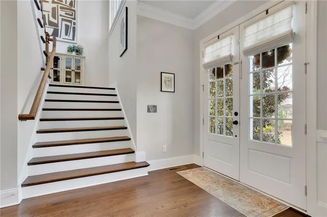 a bathroom with a toilet sink vanity and mirror