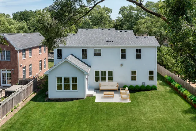 a living room with a large window table and chairs