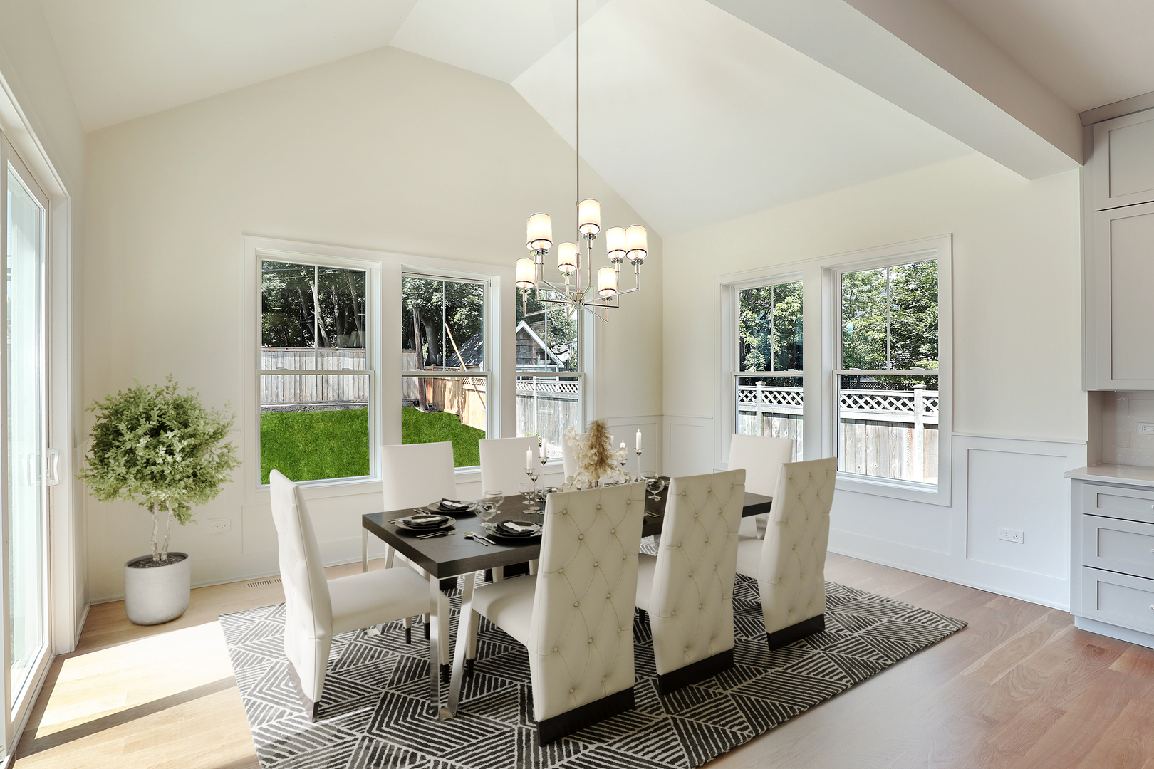 1060 Cedar Lane Northbrook, IL 60062 - Photo 8 of 31 a dining room with furniture a potted plant and a chandelier