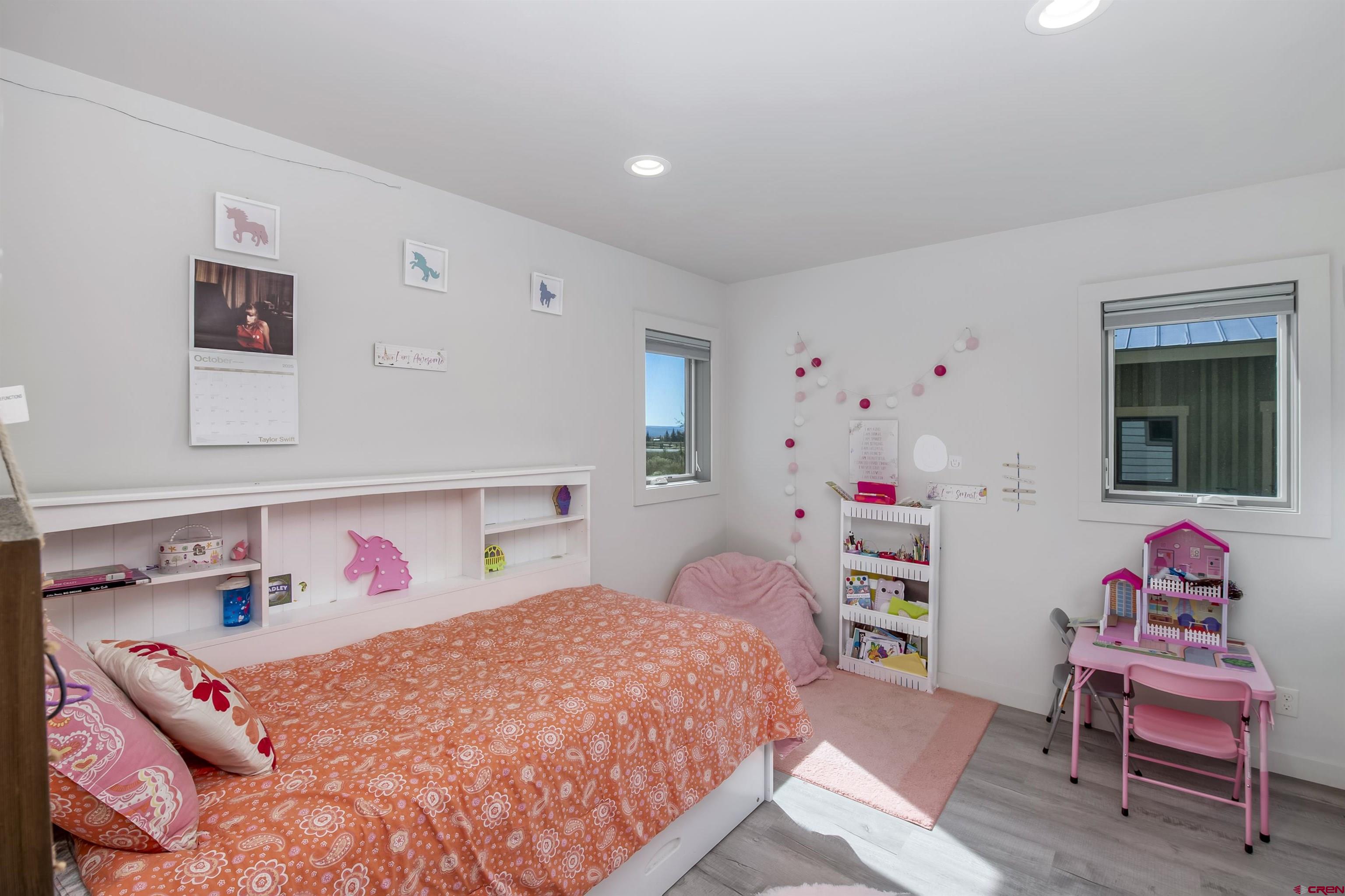 363 Cement Creek Road, Unit 3 Crested Butte, CO 81224 - Photo 14 of 34 a bedroom with a bed and a dresser