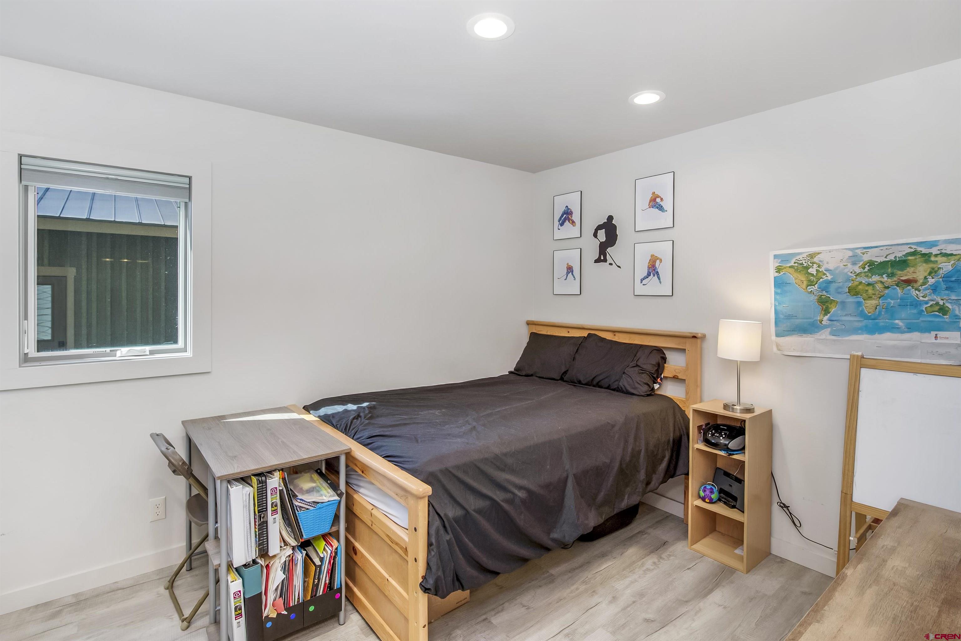 363 Cement Creek Road, Unit 3 Crested Butte, CO 81224 - Photo 18 of 34 a bedroom with a bed and a window