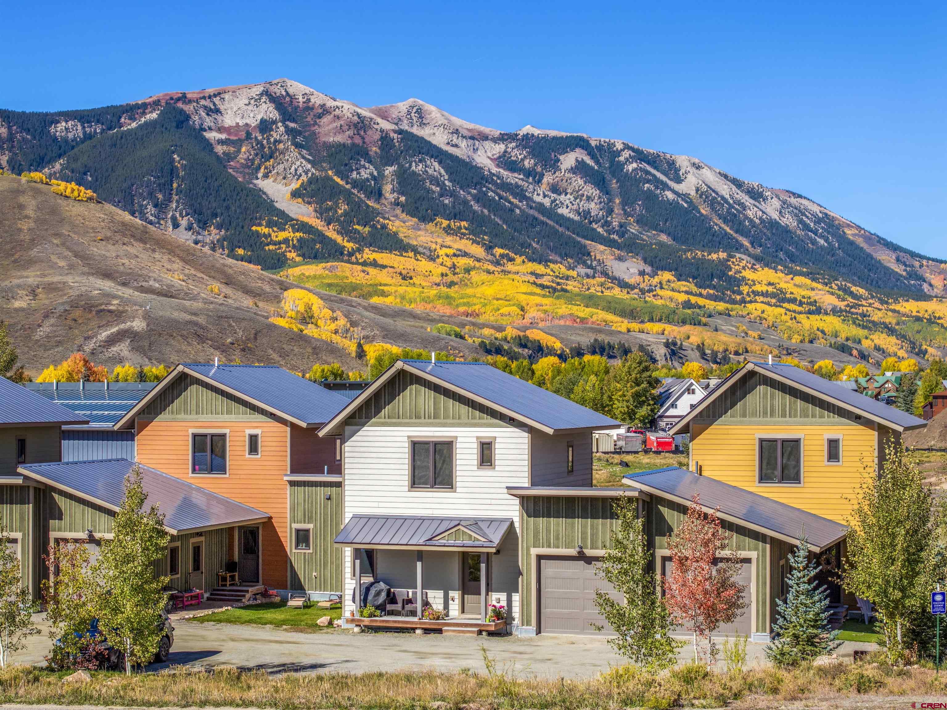 363 Cement Creek Road, Unit 3 Crested Butte, CO 81224 - Photo 27 of 34 a front view of a house with a yard