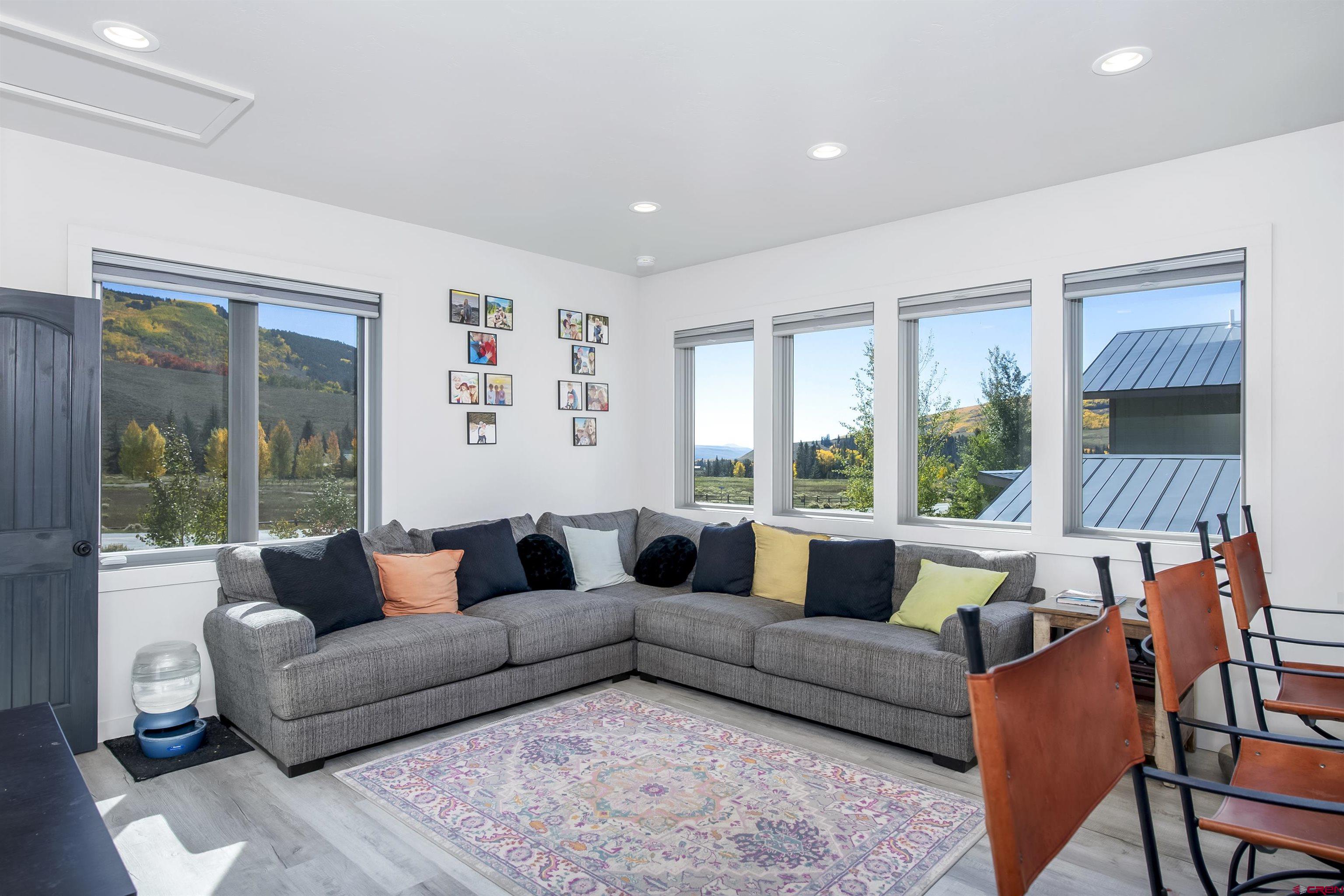 363 Cement Creek Road, Unit 3 Crested Butte, CO 81224 - Photo 6 of 34 a living room with furniture and a large window