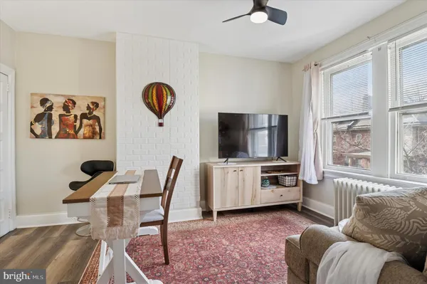 a dining room with table and chairs