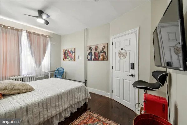 a bedroom with a bed and a table