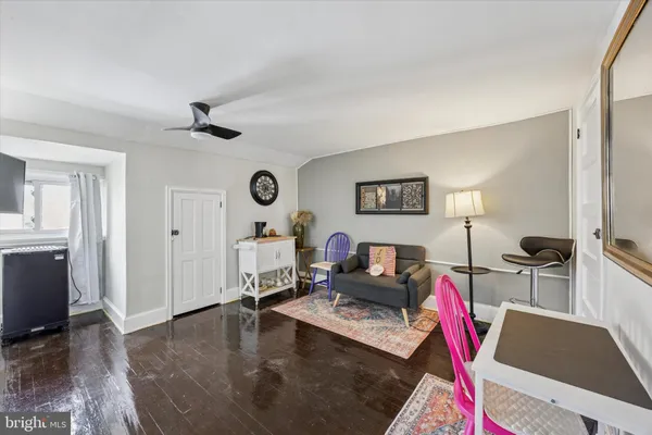 a living room with furniture and flat screen tv