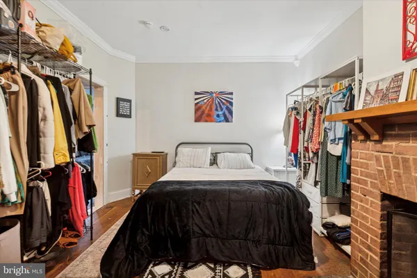 a bedroom with a bed and a walk in closet