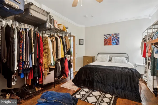 a bedroom with a bed a walk in closet