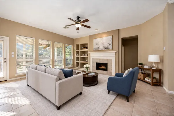 a living room with furniture and a fireplace