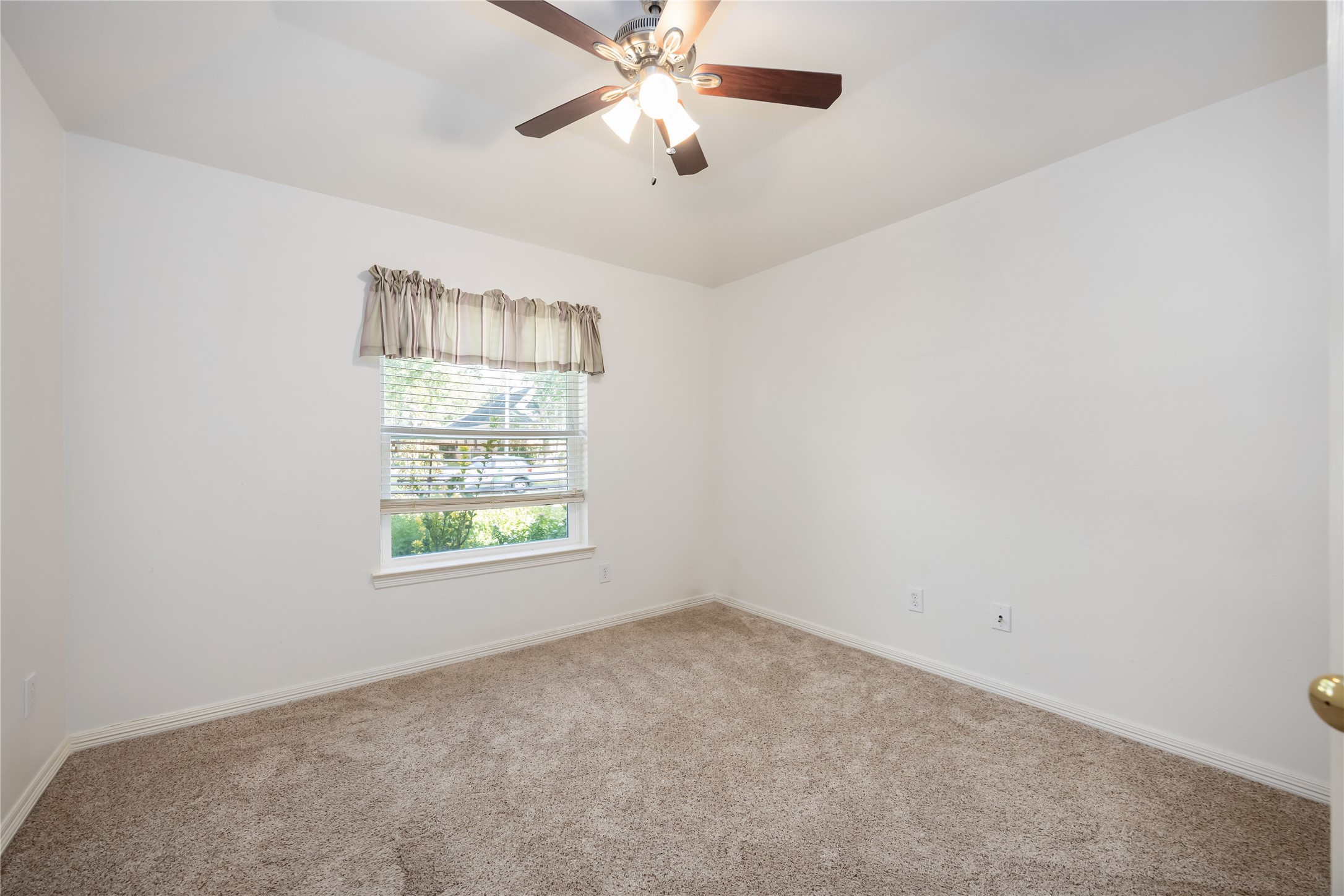 25619 Myrtle Springs Spring, TX 77373 - Photo 23 of 29 an empty room with a window and a fan