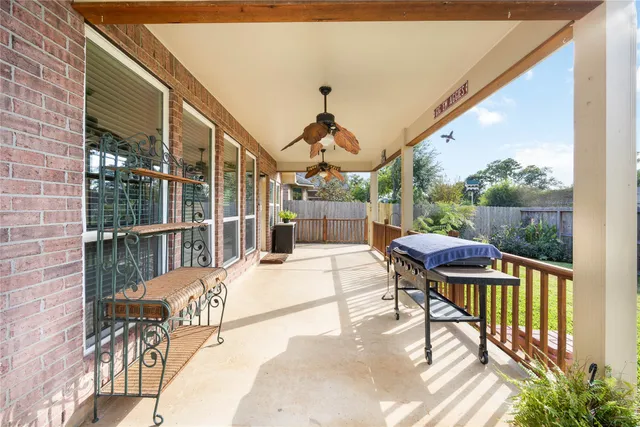 a view of a patio with a table and chairs