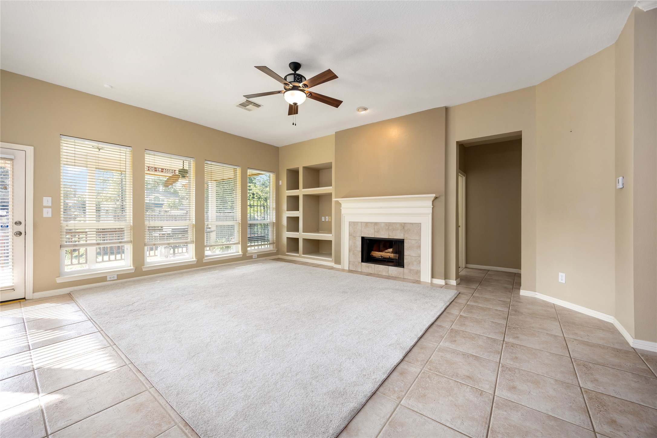 25619 Myrtle Springs Spring, TX 77373 - Photo 9 of 29 a view of an empty room with a fireplace and a window