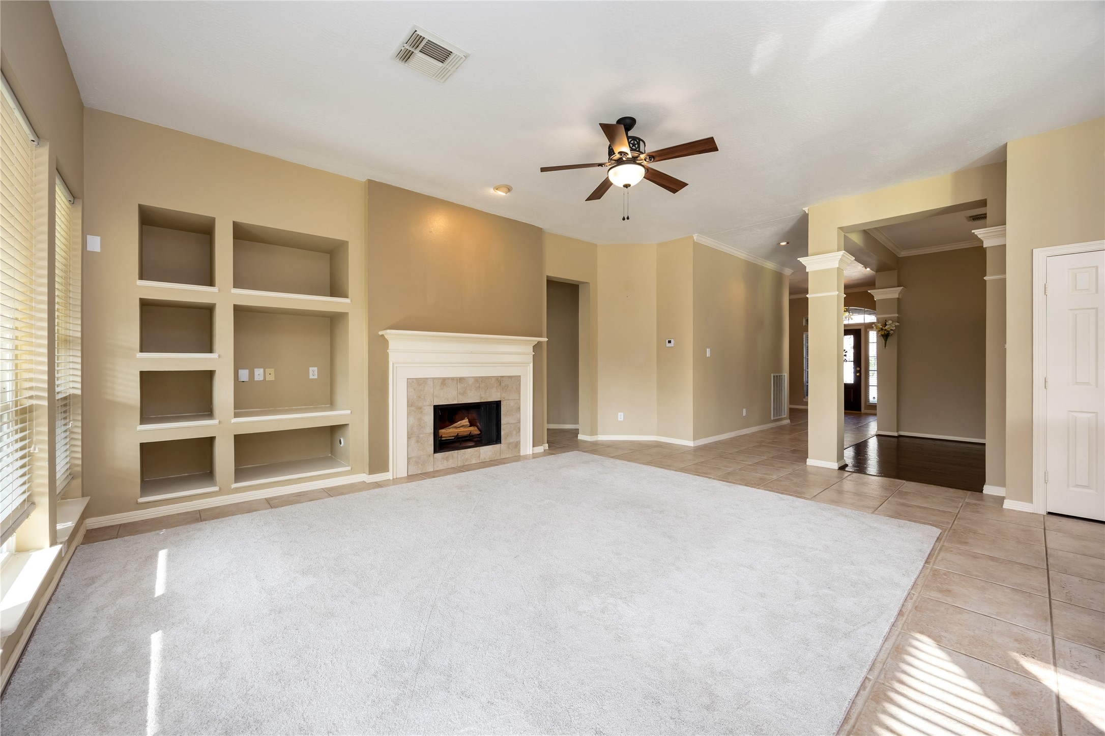 25619 Myrtle Springs Spring, TX 77373 - Photo 10 of 29 a view of an empty room with a fireplace and a window