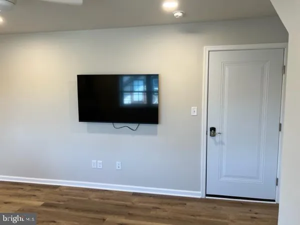 a view of a living room with a flat screen tv