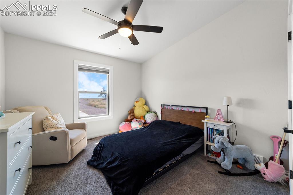 38640 Jones Road Rush, CO 80833 - Photo 21 of 41 a bedroom with a bed and a window