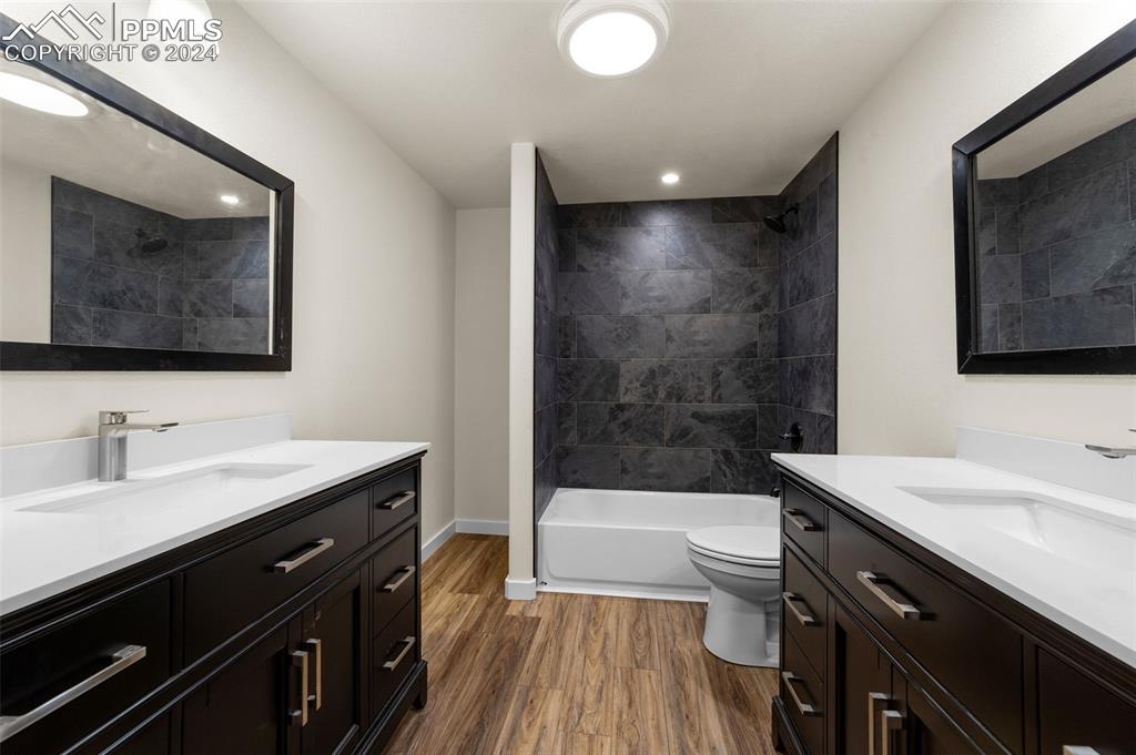 38640 Jones Road Rush, CO 80833 - Photo 33 of 41 a bathroom with a sink a toilet a mirror and bathtub