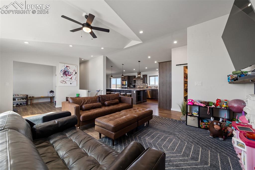 38640 Jones Road Rush, CO 80833 - Photo 4 of 41 a living room with furniture kitchen view and a wooden floor