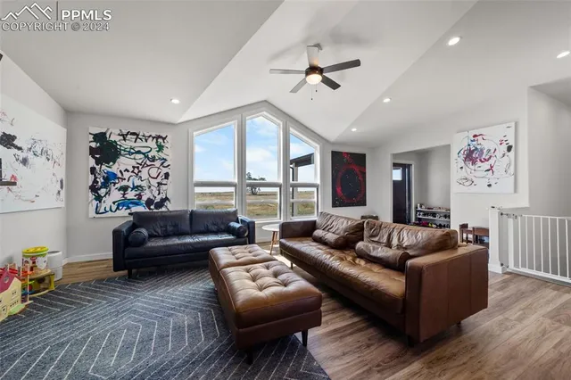 a kitchen with stainless steel appliances granite countertop a kitchen island a stove a table and chairs