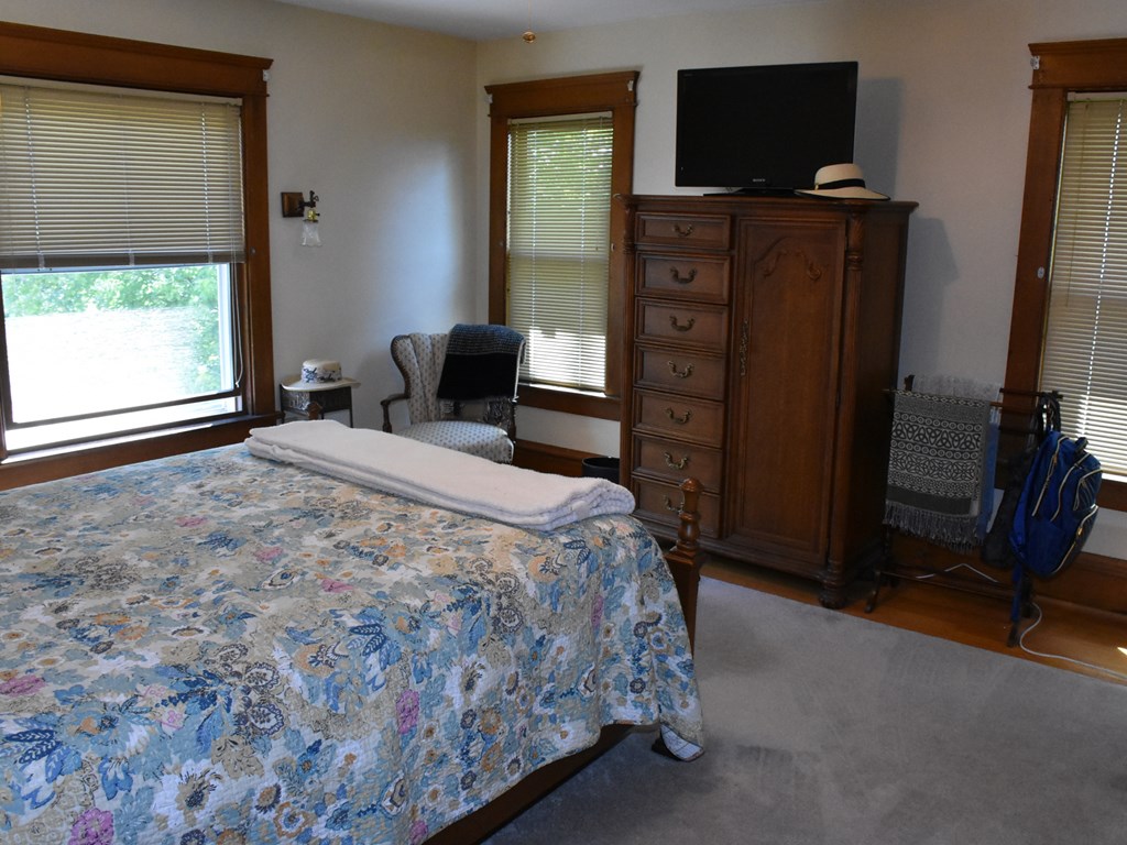 655 Chestnut Street Meadville, PA 16335 - Photo 24 of 43 a bedroom with a bed and a television in it