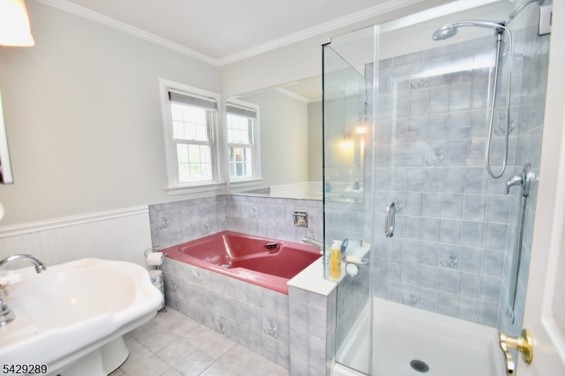 16 Pequot Trail Oak Ridge, NJ 07438 - Photo 11 of 18 a bathroom with a tub sink shower and mirror