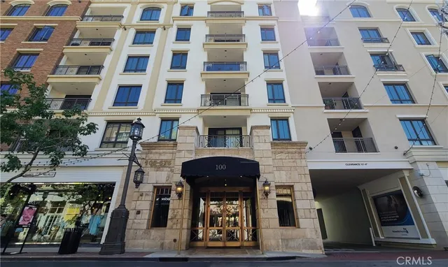 a front view of a building with many windows