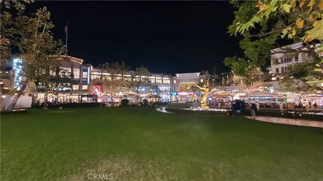 a view of a park with large trees