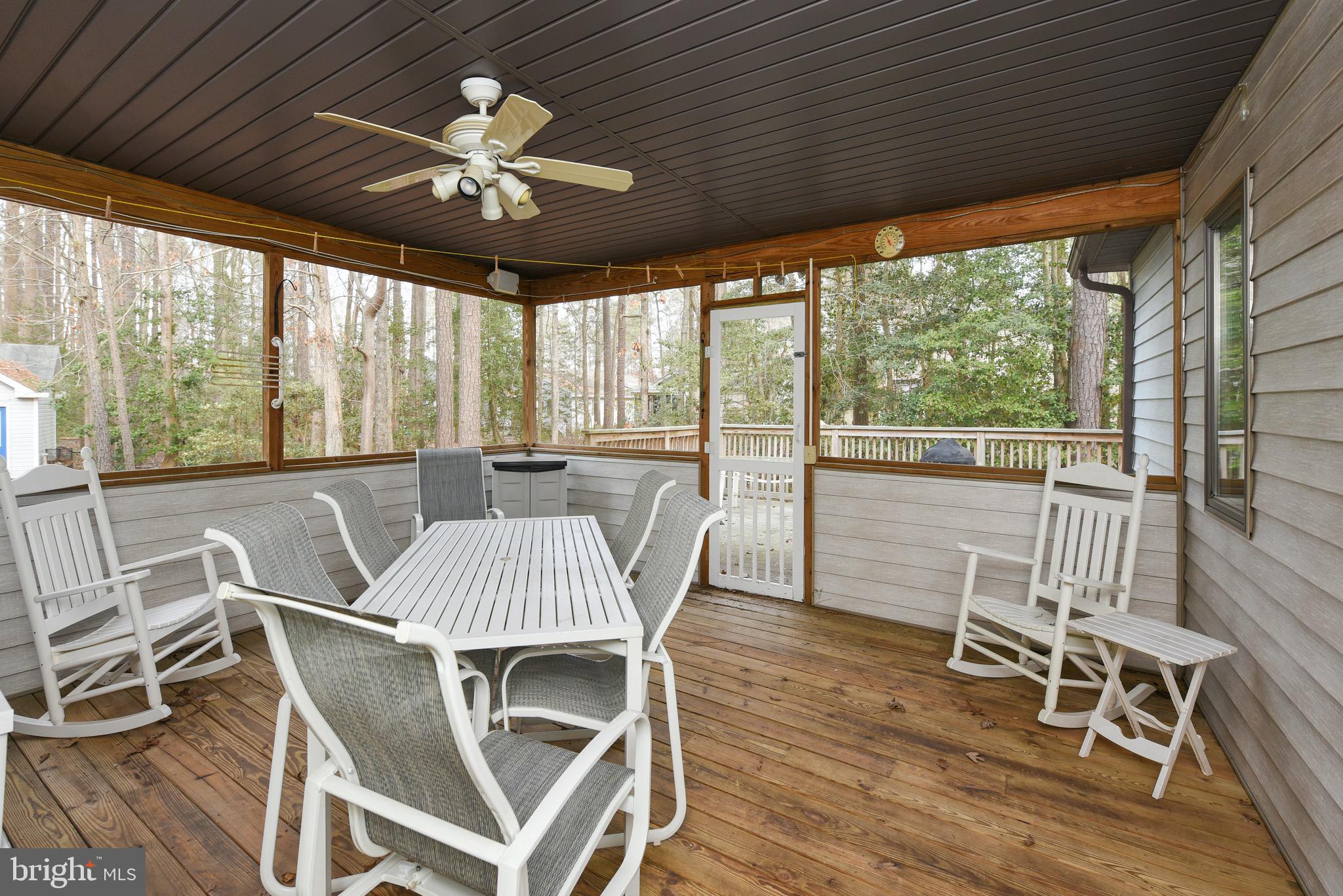 106 Sandyhook Road Ocean Pines, MD 21811 - Photo 22 of 52 a view of a dining room with furniture wooden floor and chandelier